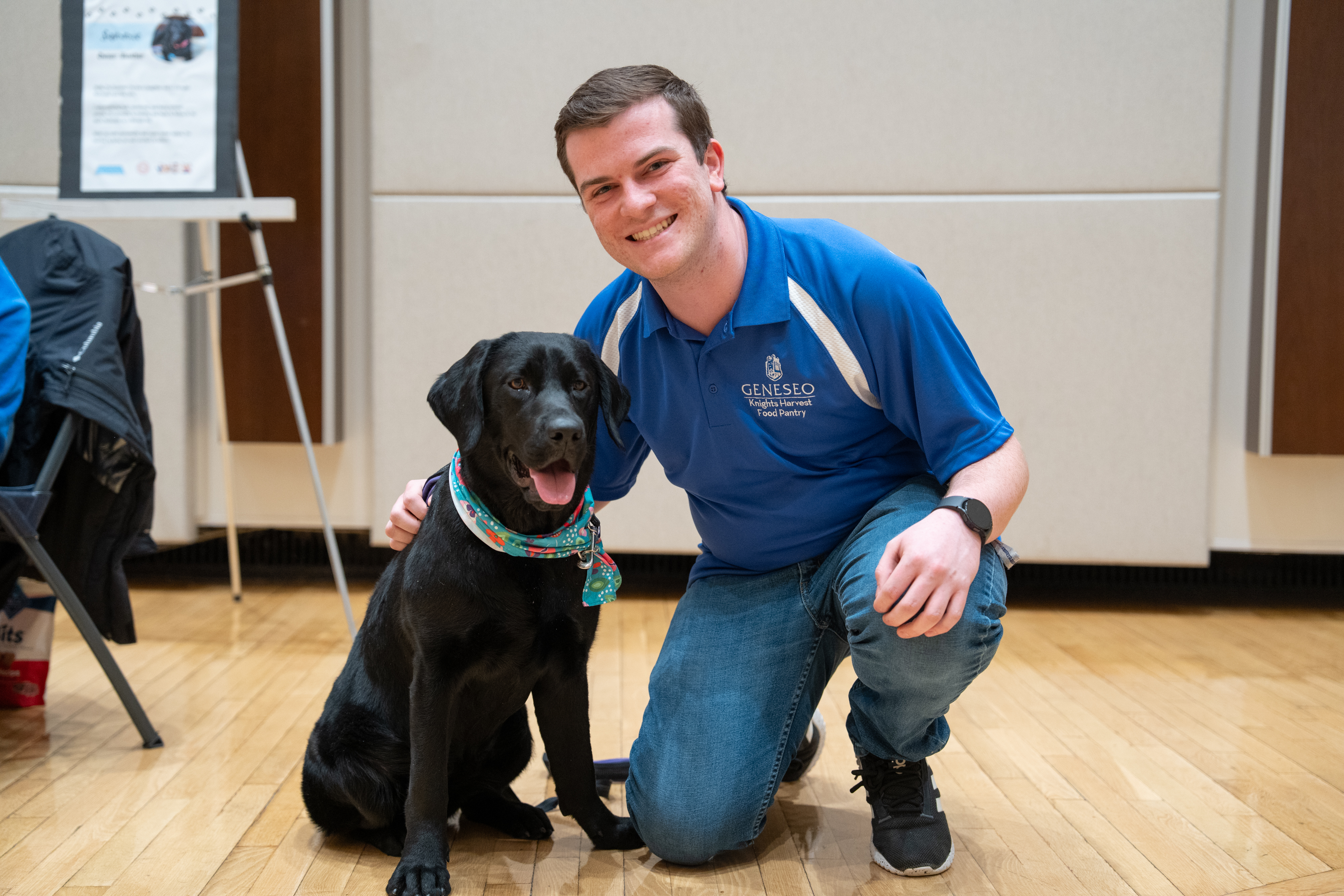 Student posing with Therapy dog
