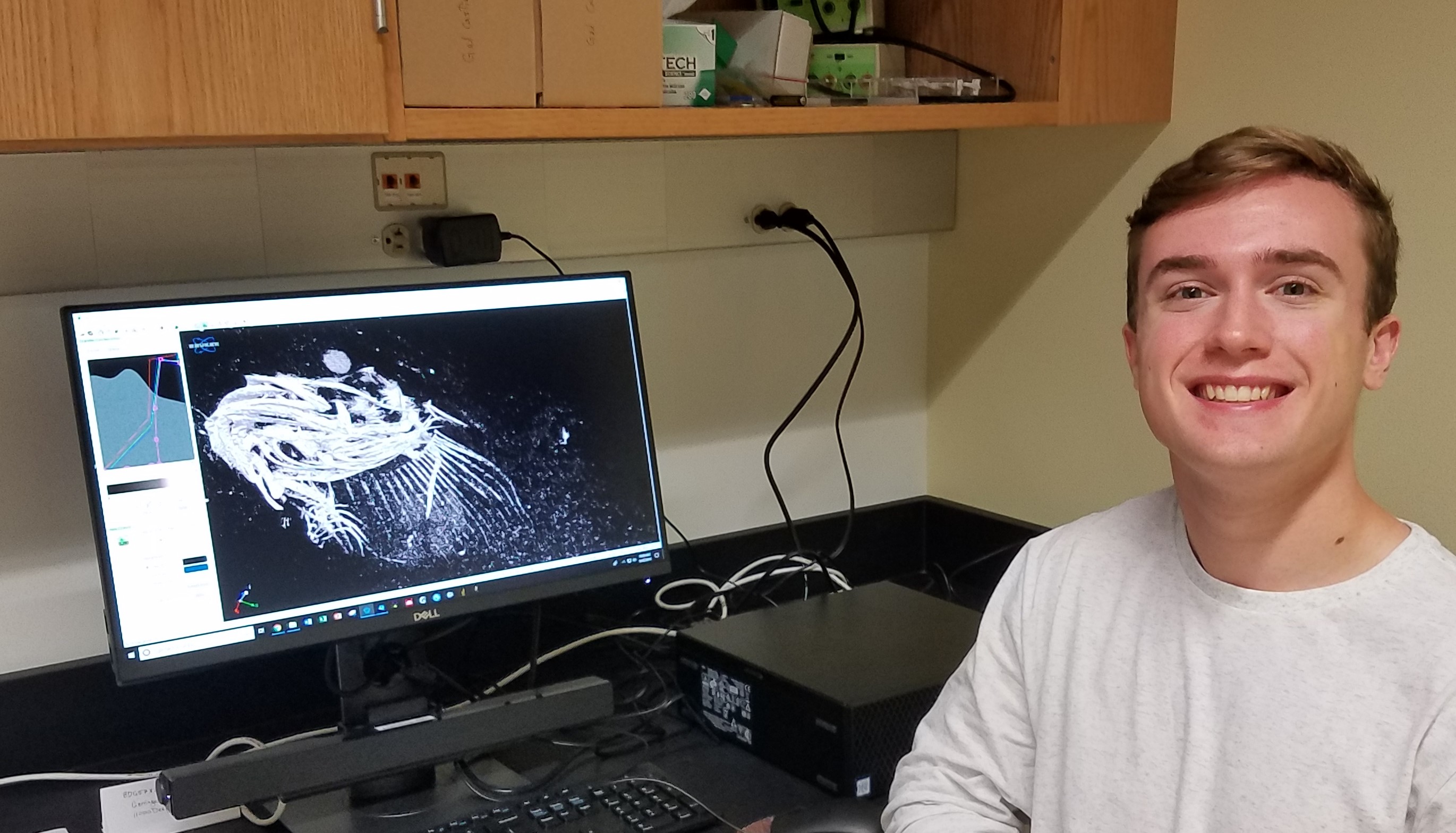 Brett Woodward with CT scan of fish