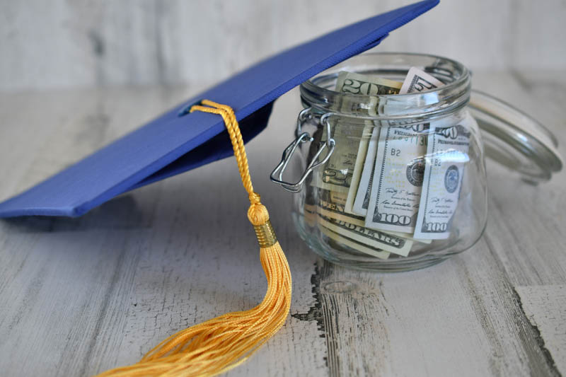 Graduation cap and jar of money