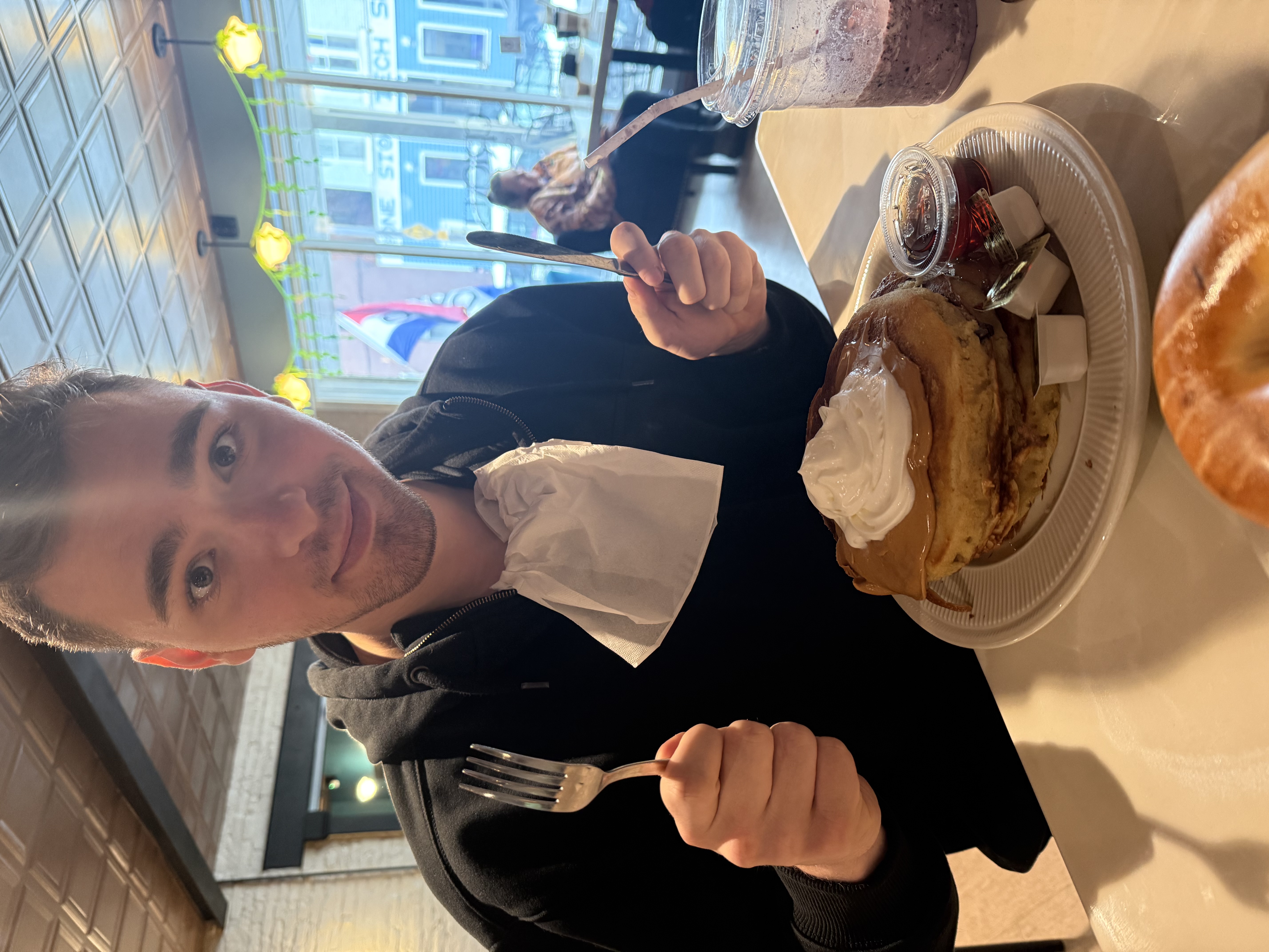 image of Evan eating a pancake