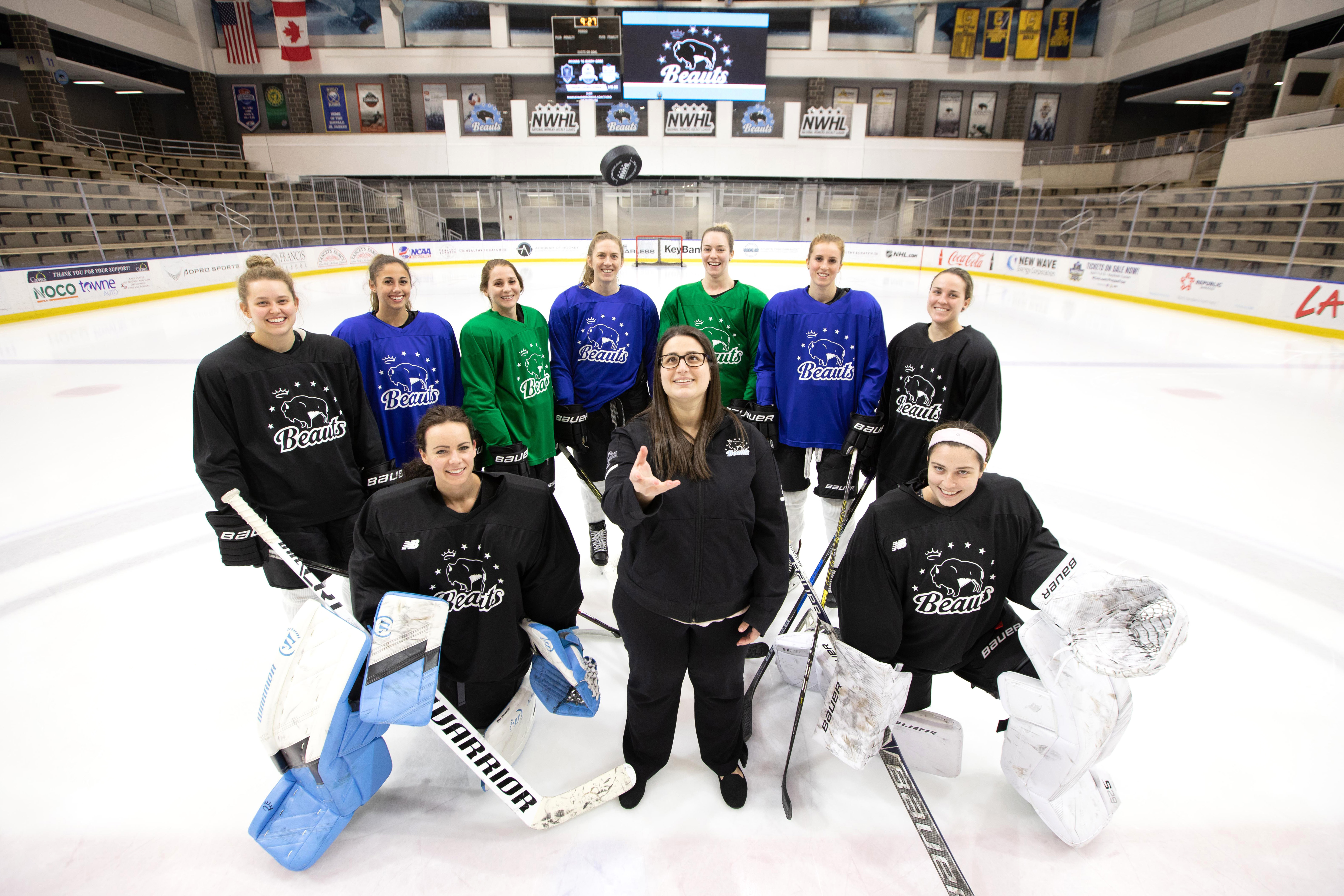 Jami Cohen '15 throws a puck into the air with the Buffalo Beauts