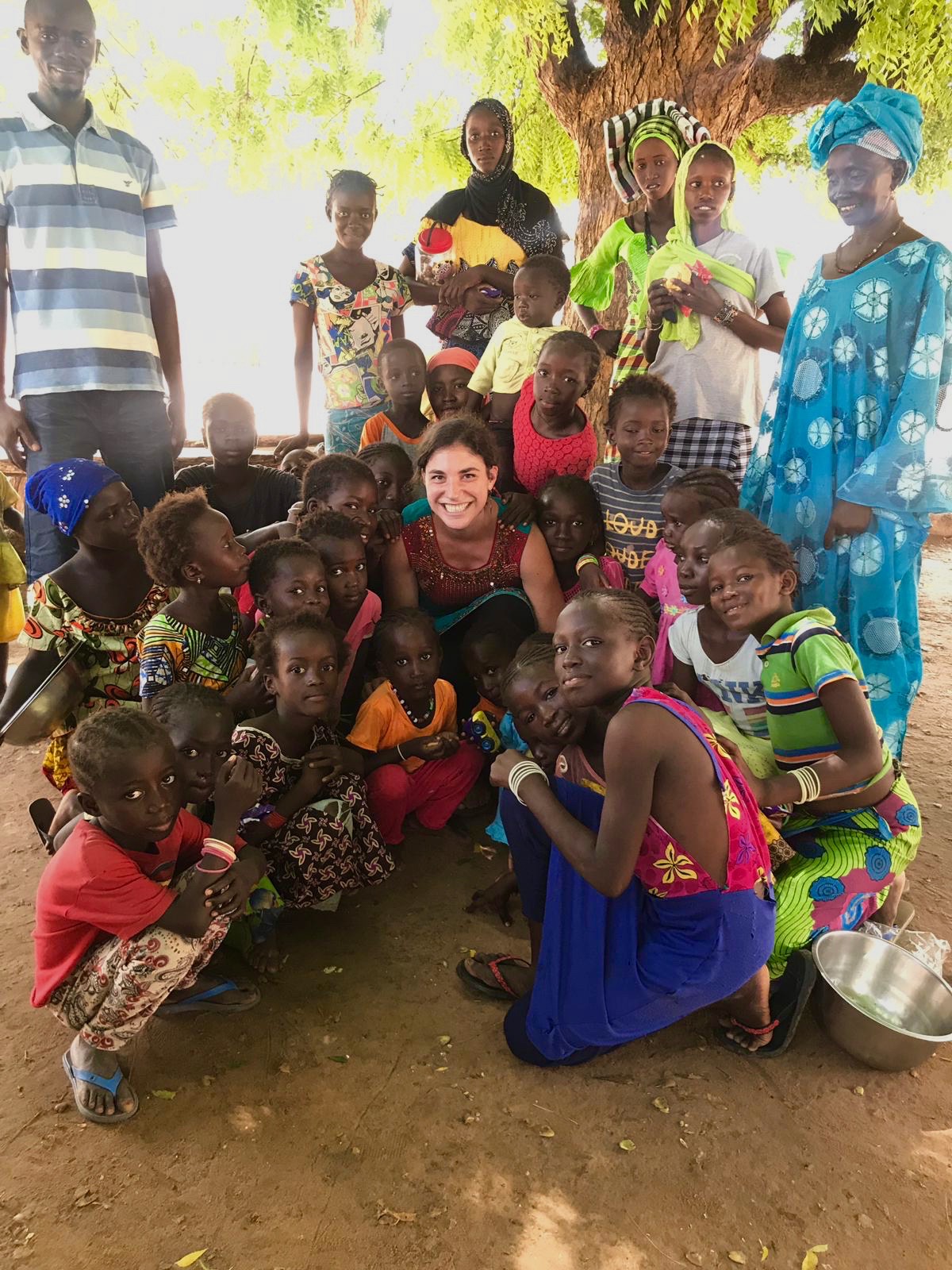 Holly Nicole Kandel '16 poses with women and girls of a village in Senegal.