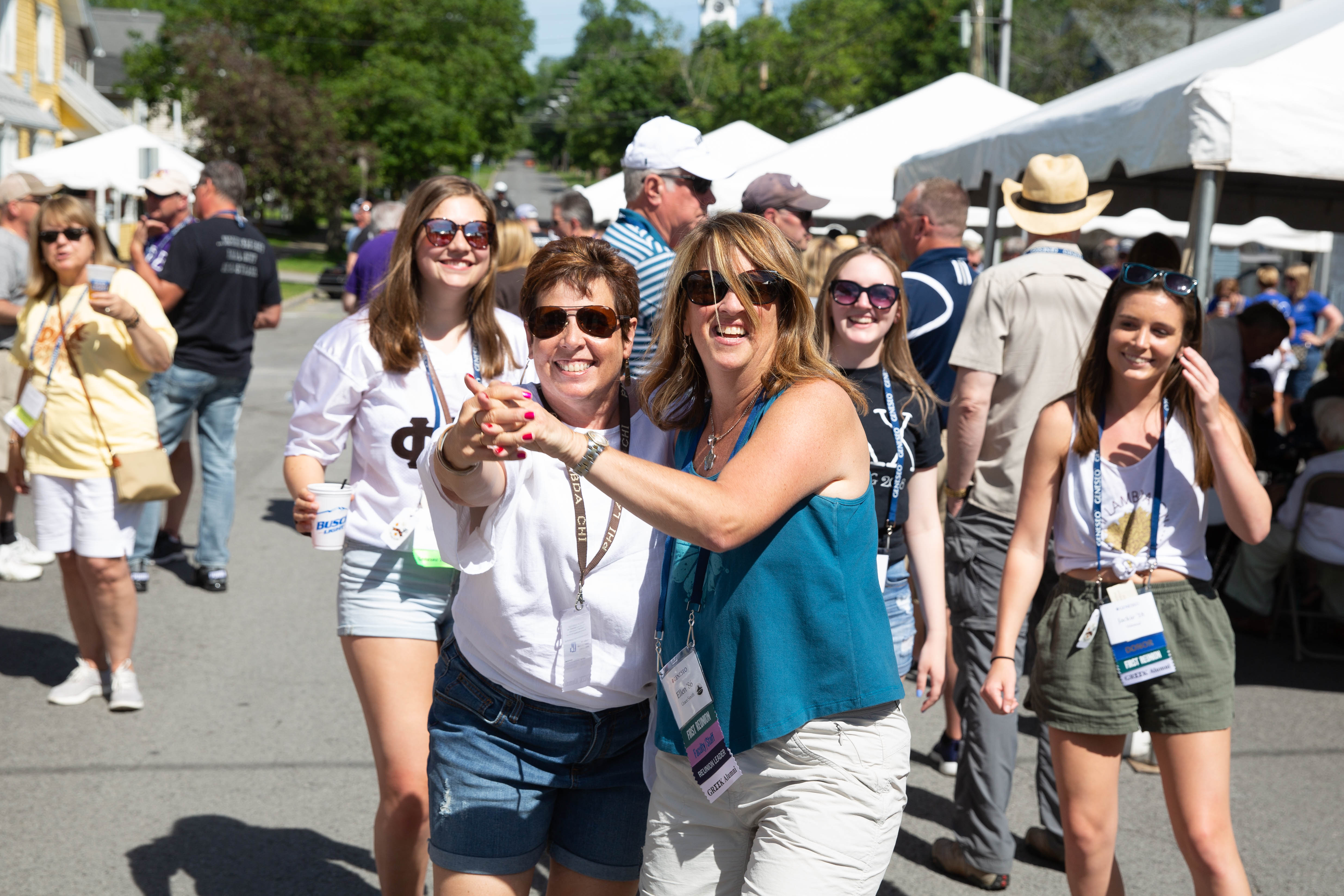 Two alumni dance at the block party