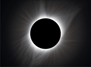 a photo of the sun blocked by the eclipse with the corona radiating out from behind