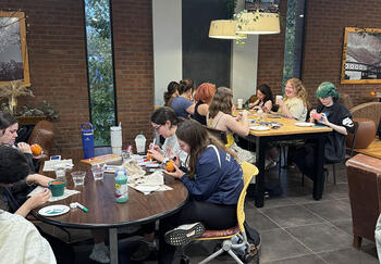 Students paint pumpkins at a Transfer Connect Club meeting in MacVittie College Union. (Image provided)
