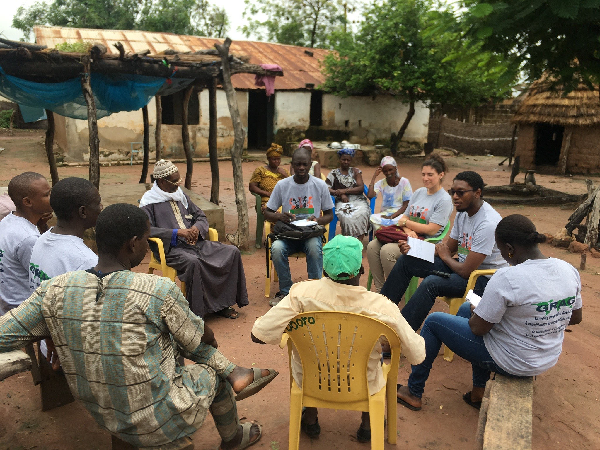 Holly Nicole Kandel '16 speaks with a village chief and health leader.
