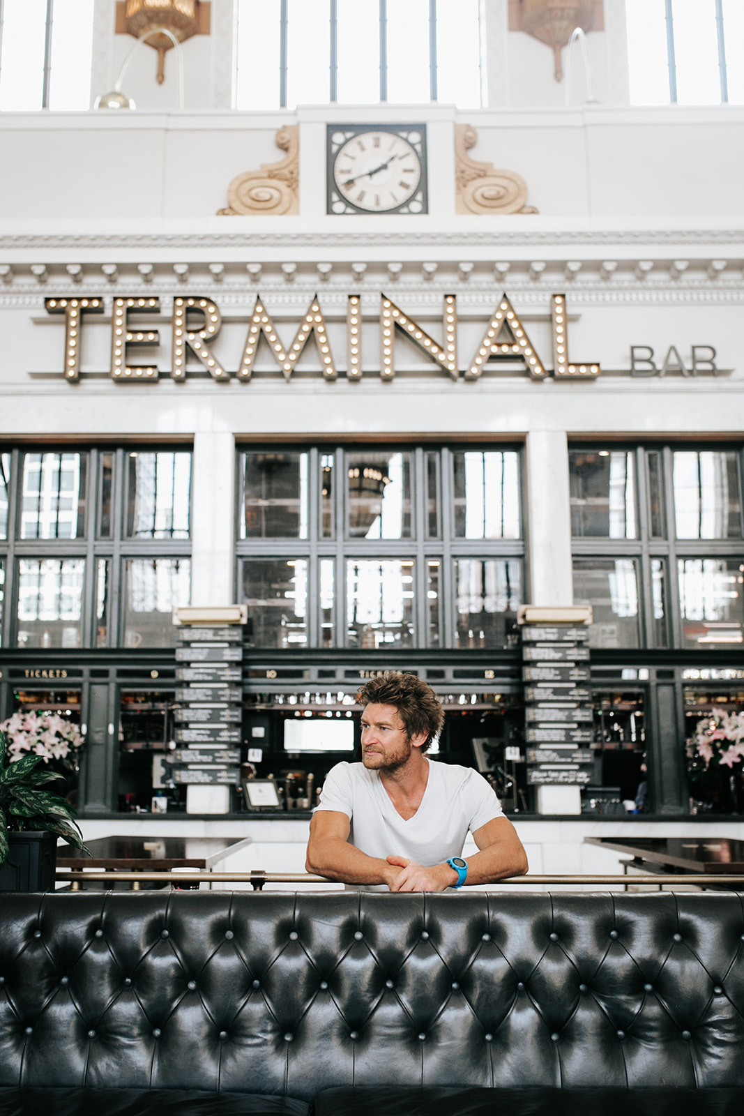 Eric Hinman '02 sitting in Denver's terminal