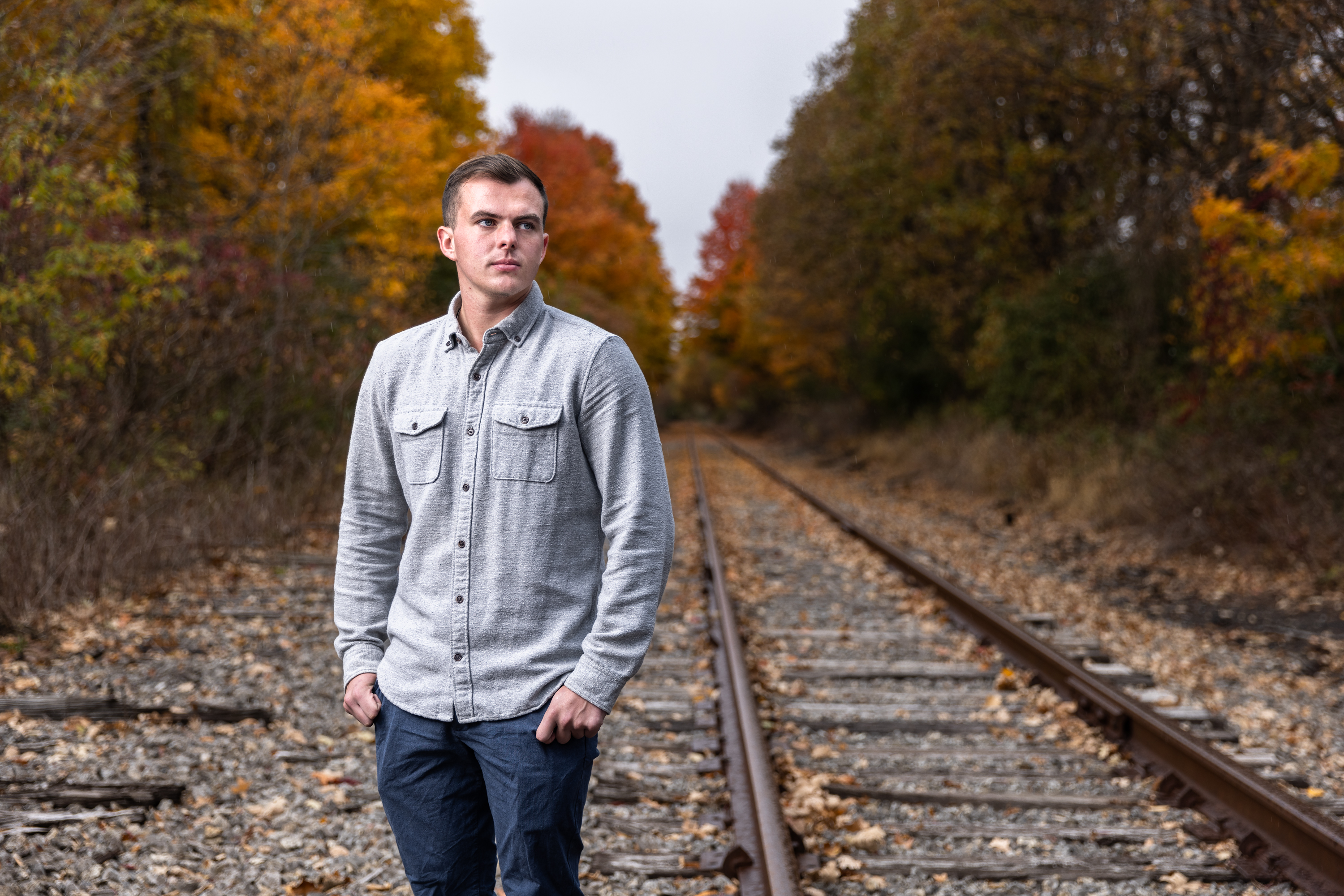 Jake Domagal '22 standing beside the railroad tracks on which the accident happened.