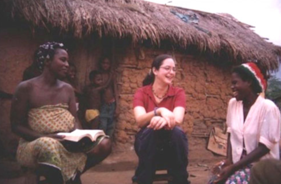 Danielle Ellingston '97 with a family in Ghana.