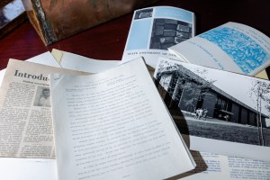 A course catalog and a photo of the new library in 1966.