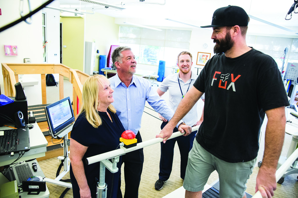 Mark and Sue work with patient Lane Kirk. “We get people back to work, and we’ve had them tell us: ‘You gave me my life back,’” says Sue. “It can be sad work sometimes, but it’s also very rewarding.”
