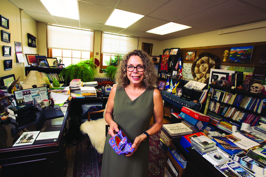 Rose Mcewen holds a mask given to her by a student.