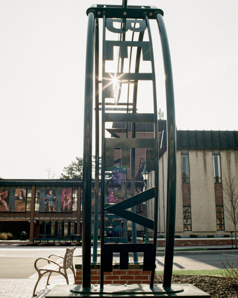 Sculpture with the word "Believe."