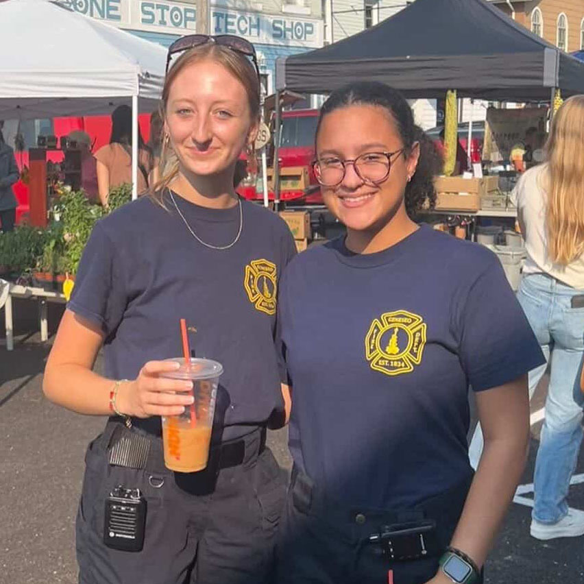 Jordyn Farner and Yovanka Nunez pose for a photo in their Geneseo Fire Department Uniforms