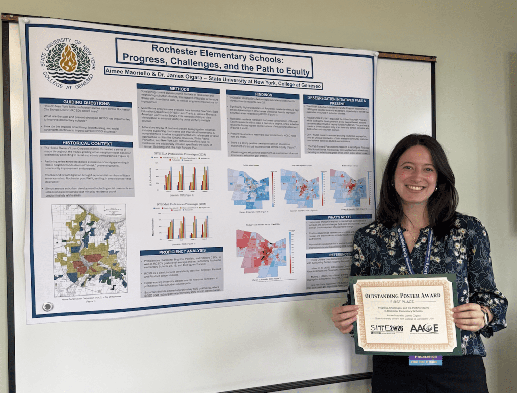 A white woman with long, dark hair stands in front of a research poster while holding her award certificate.