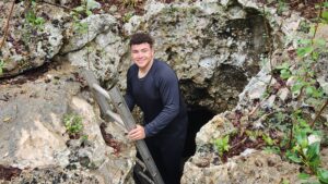 Gabe Bellamy '27 exits a cave.
