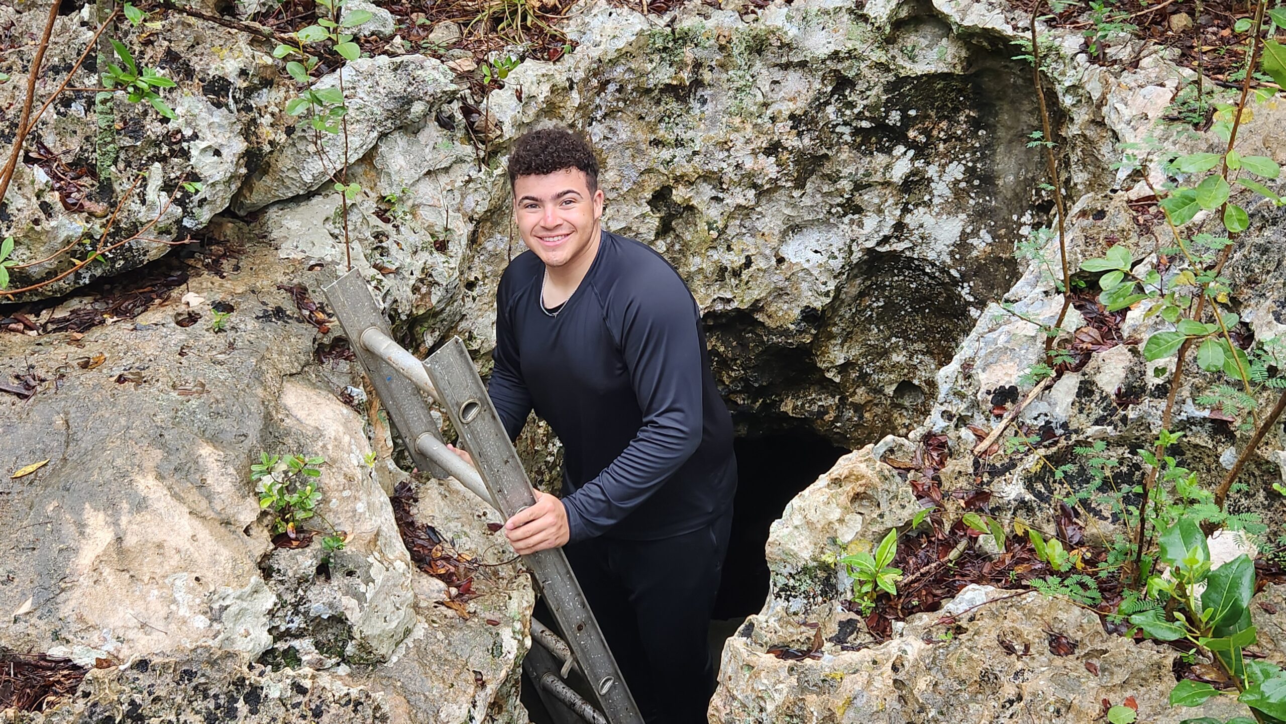 Gabe Bellamy '27 exits a cave.