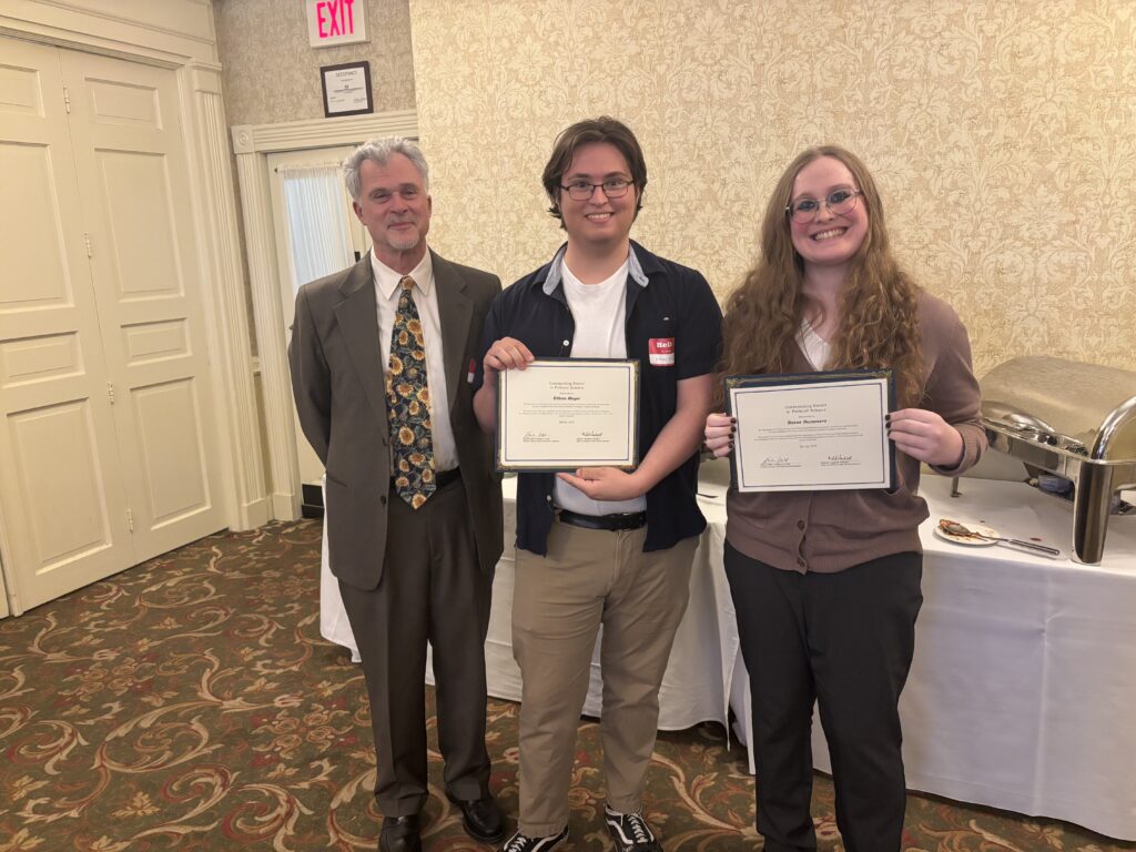 Professor Jeff Koch and two students award winners.