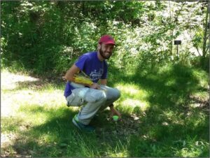 Sam Heraghty ('18) doing a bee survey in the Arboretum in summer 2017.