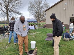 Multicultural Affairs Director Clifton Harcum and Boz at the 2026 Earth Day Celebration