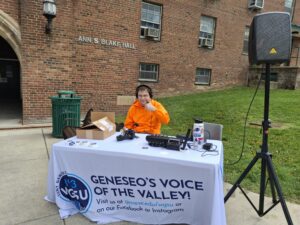 WGSU staffer Edison sitting at table for WGSU Day