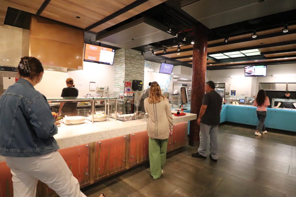 Red Jacket Dining Hall Station with Students being served