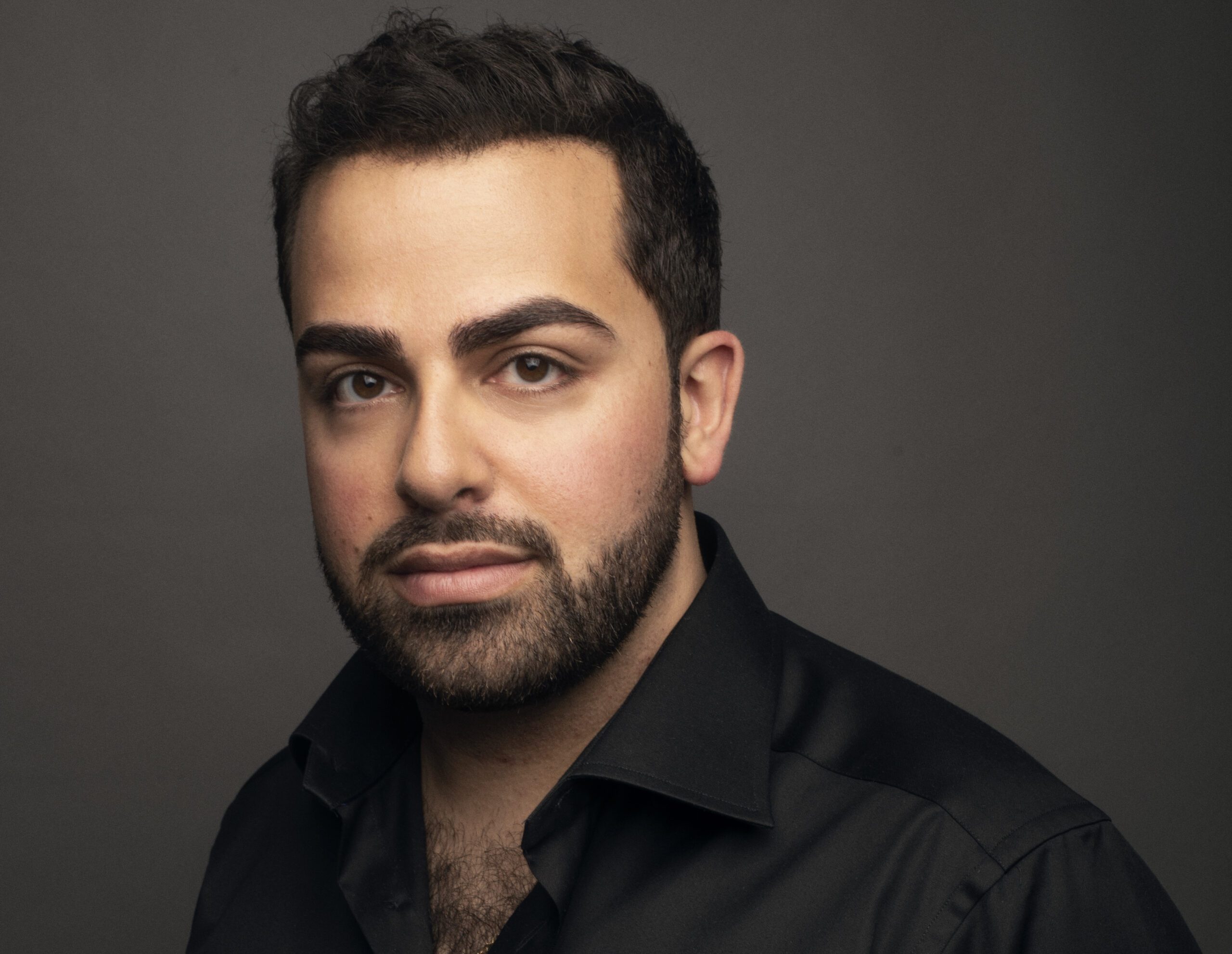 Louis Lohraseb '13 wearing a black shirt.