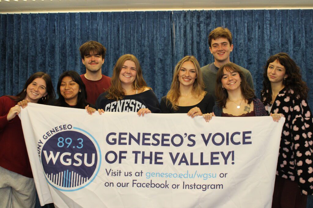 WGSU student leaders holding a WGSU banner